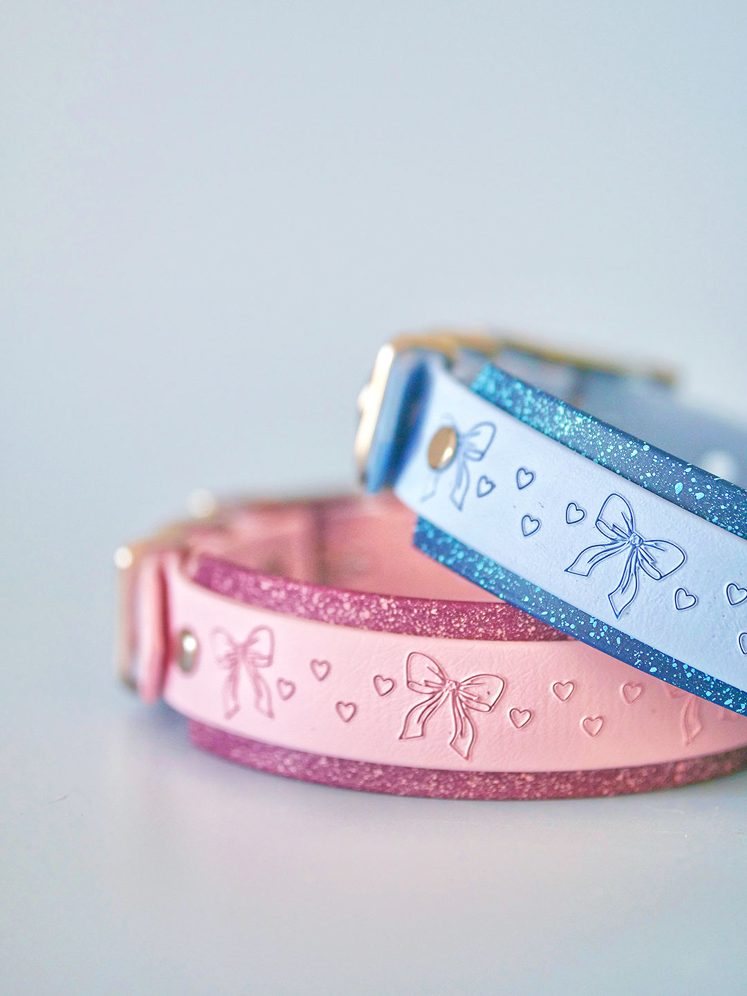 Close-up of pixie hound dog collar with speckled star merlot backing and embossed design