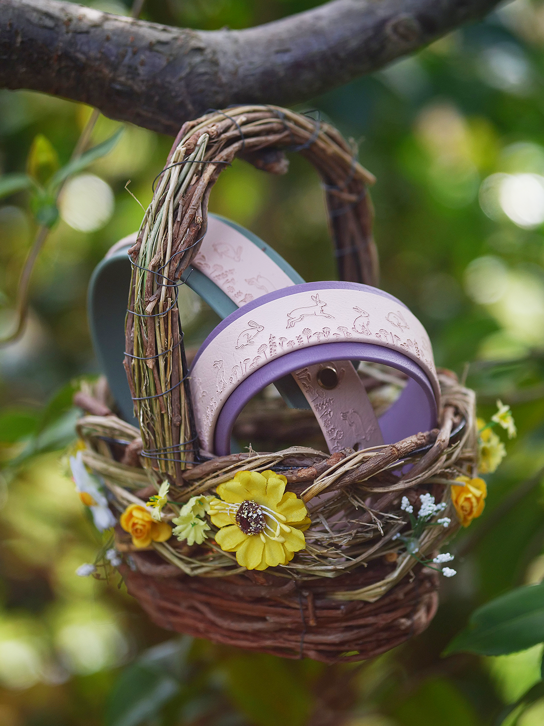 Champagne and mauve dog collar with hare motif displayed in countryside scene