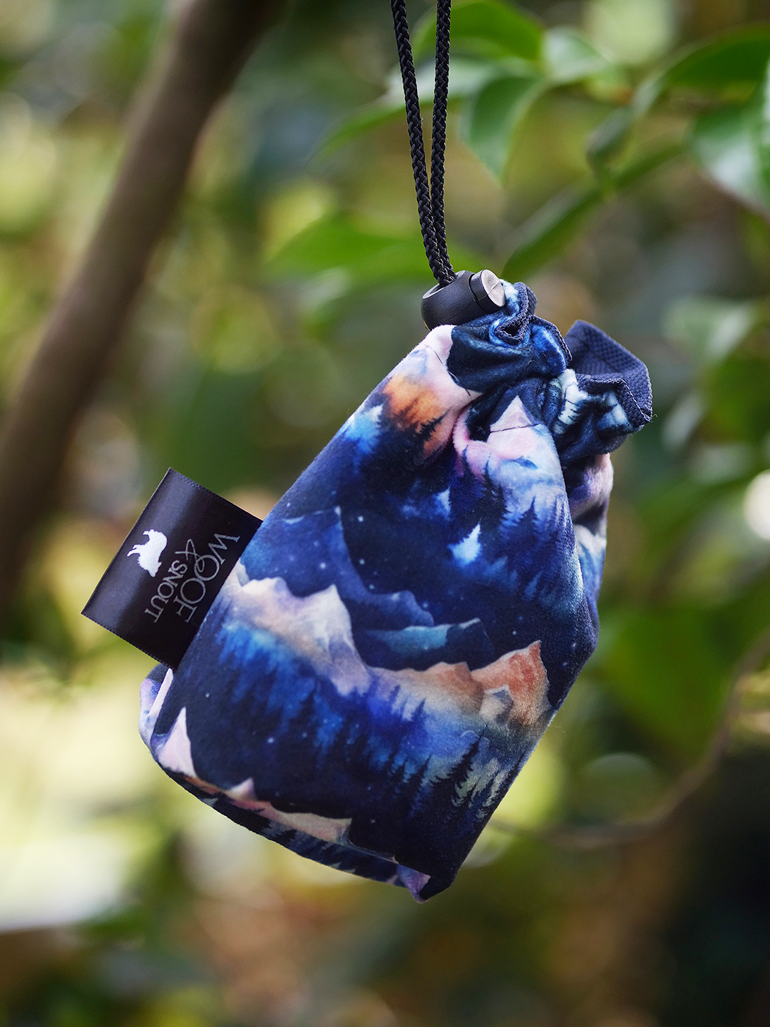 nightfall dog treat bag blue mountain pattern hanging from tree branch outdoor