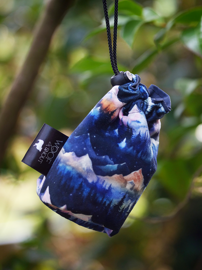 nightfall dog treat bag blue mountain pattern hanging from tree branch outdoor